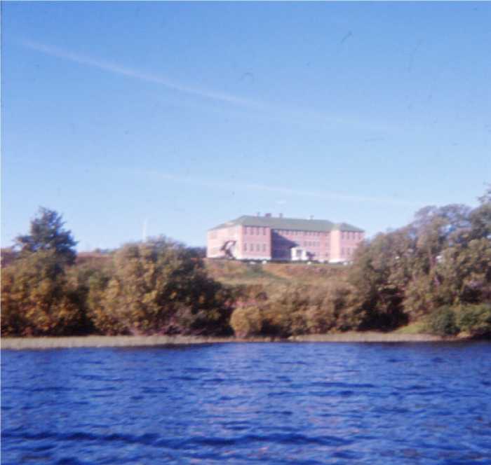 Lejac Residential School on hill above water